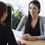 Shot of two young professionals having a discussion at a desk